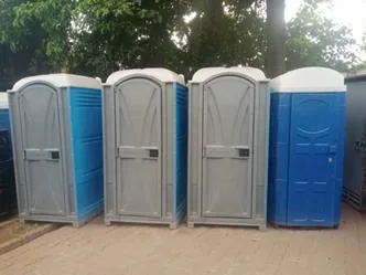 Row of portable temporary toilet units supplied and maintained on site